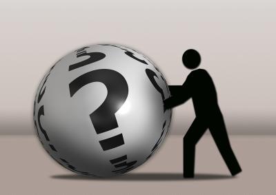 Illustrasjon: En figur som skyver en stor ball med spørsmålstegn